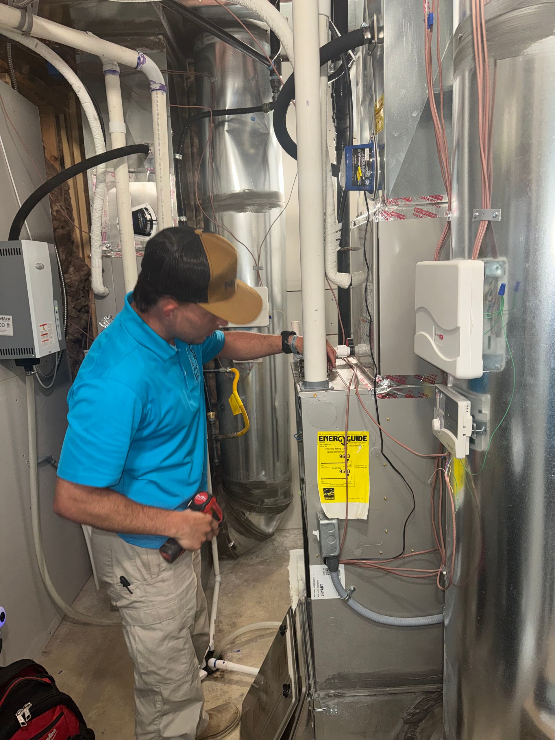 furnace maintenance in a tight mechanical room in the heart of your home image