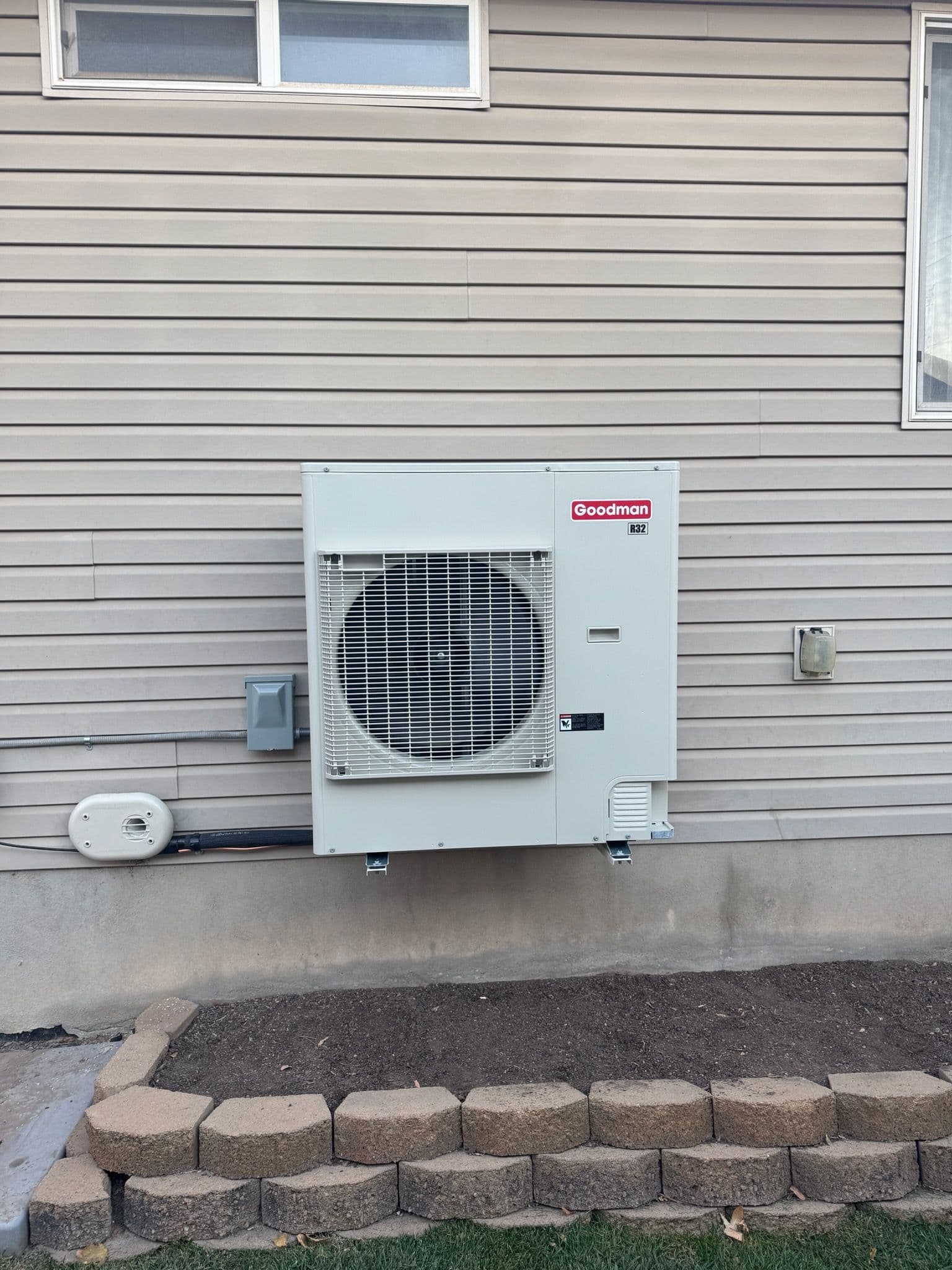 Efficient Goodman AC Installation in Wood Cross image